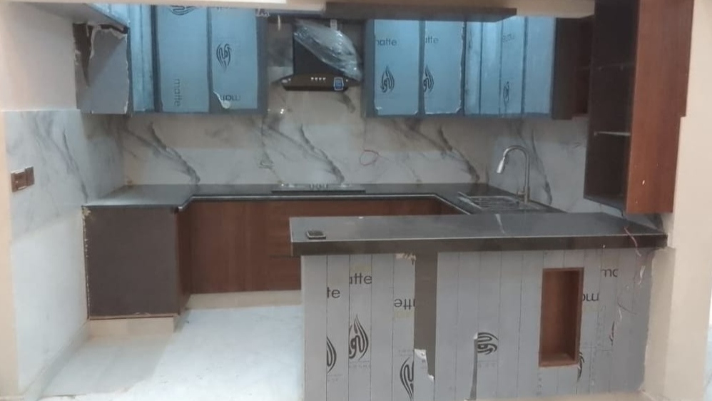 Modern kitchen design and renovation project completed in Karachi by Etminaan Services